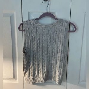 It is a wild fable sweater vest. It is a size small. It fits perfectly